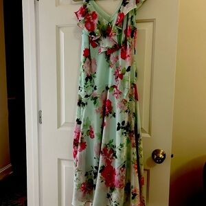 Mid length mint ruffled cocktail dress.